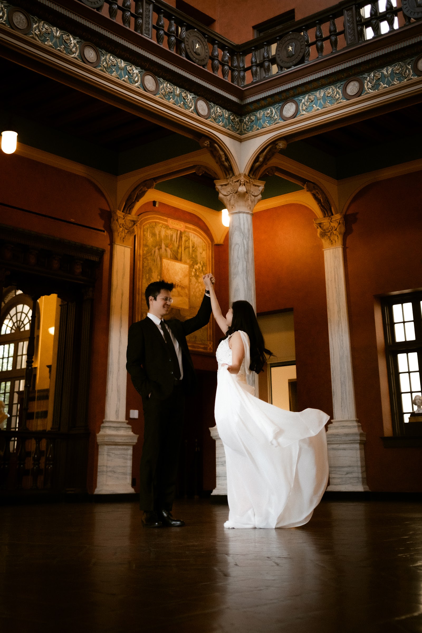 A first look shared in the warm glow of a grand hotel lobby