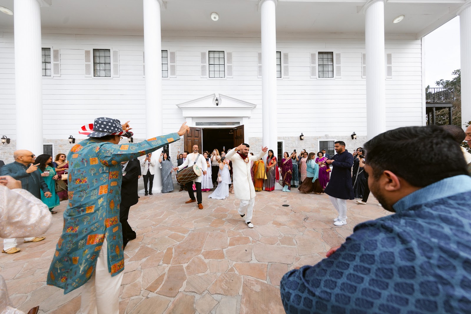 An aerial view of a couple in a quiet courtyard moments after the ceremony